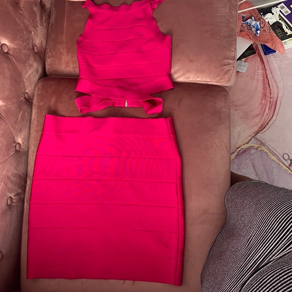 Bran new BEBE matching bandage crop top and skirt in fuchsia